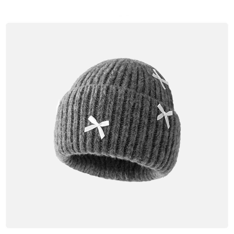 Wholesale Sweet woolen hat with bow for autumn and winter